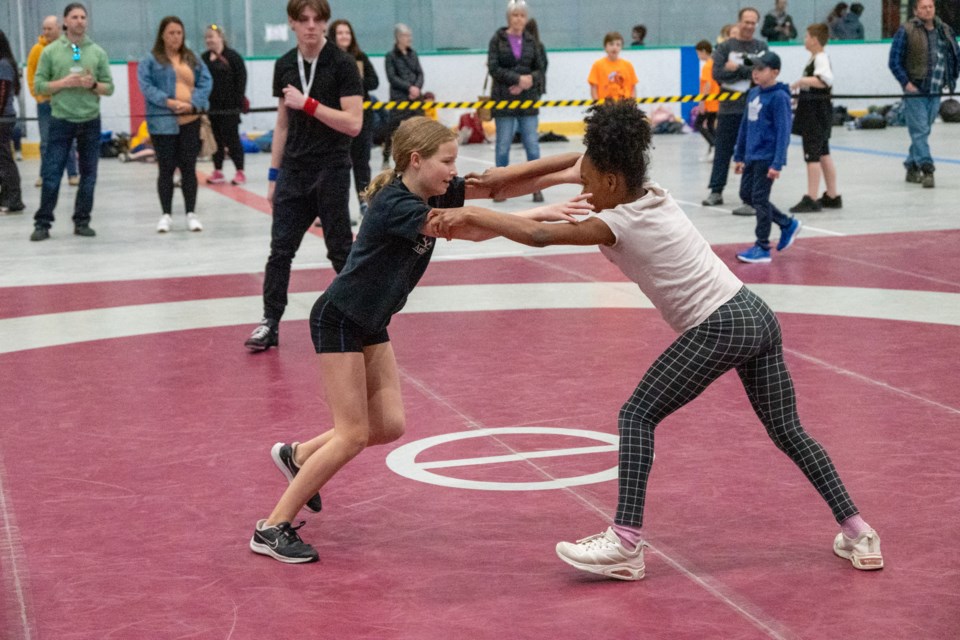 Amelia Collins and Ysabella Cruickshank from Ardagh Bluffs Public School tie up during the Simcoe County Elementary School wrestling championships on Thursday at Rotary Place in Orillia.