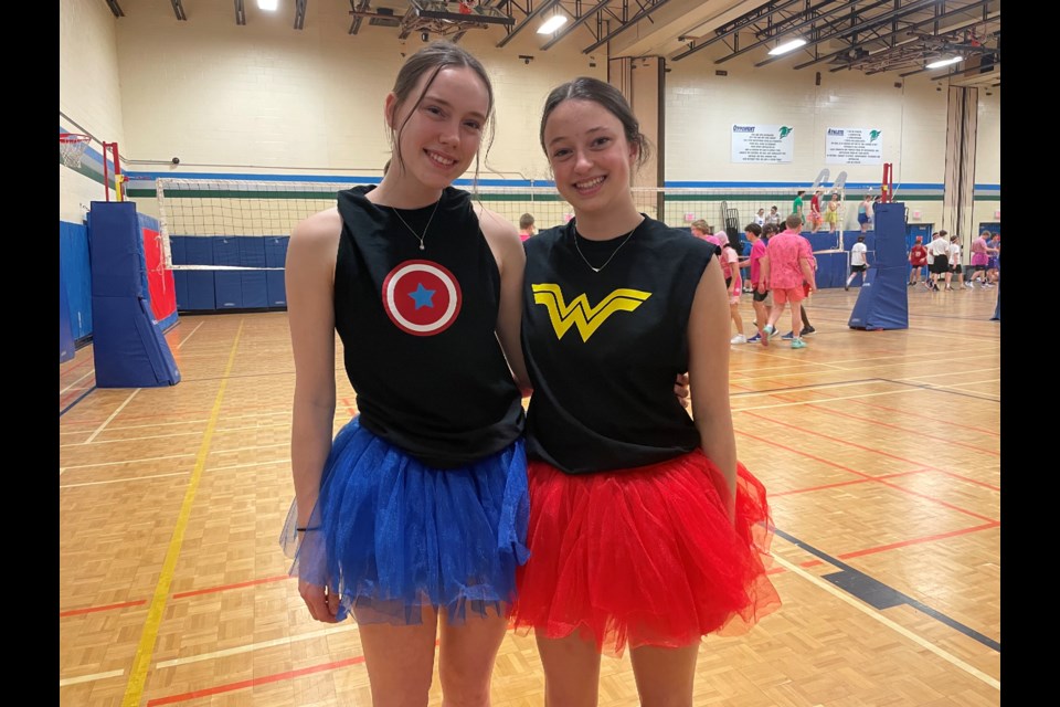 Grade 12 students Paige Baxter, left, and Alicia Murphy wore superhero-inspired attire for the Twin Lakes Secondary School 24-hour volleyball marathon that began on Wednesday afternoon. 