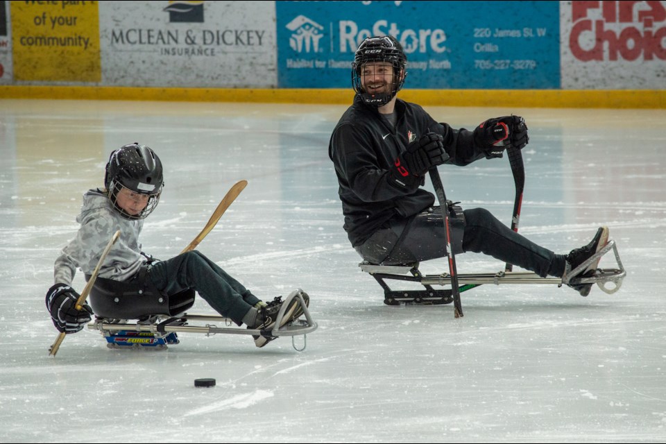 Tyler McGregor, who won a silver medal at the Beijing Olympics as the team captain for the Canadian sledge hockey team, was at Rotary Place this morning teaching the adaptive sport to local students. 
