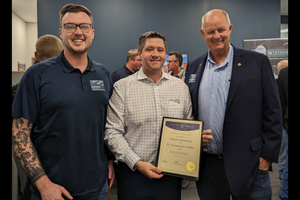 Rama First Nation Coun. Dillon Bickell, left, is shown with Nick Smith, centre, incoming office manager at Tatham Engineering in Orillia, and Orillia Mayor Don McIsaac at the Tatham Engineering client appreciation open house earlier this week.