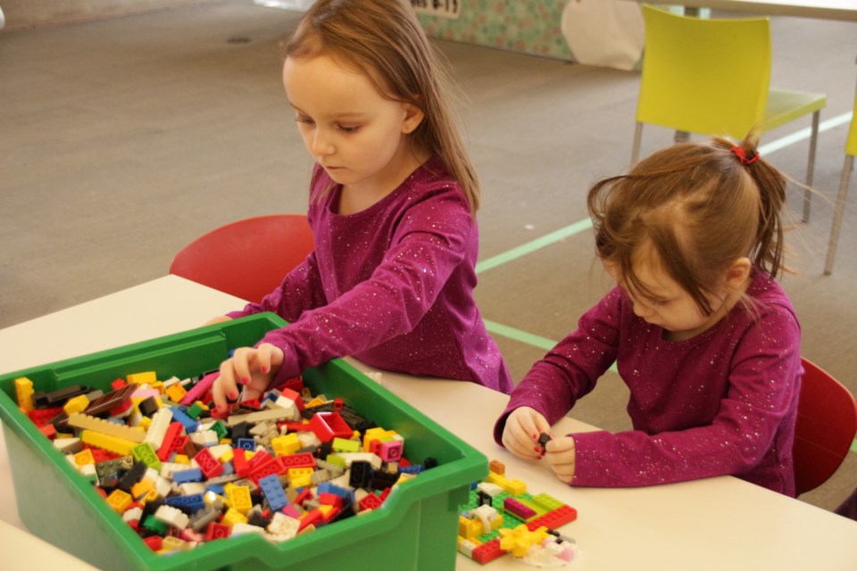 Sisters Olivia, 5, and Haleigh Weasner, 3, played with Lego pieces at the Orillia Public Library Saturday afternoon. Mehreen Shahid/OrilliaMatters