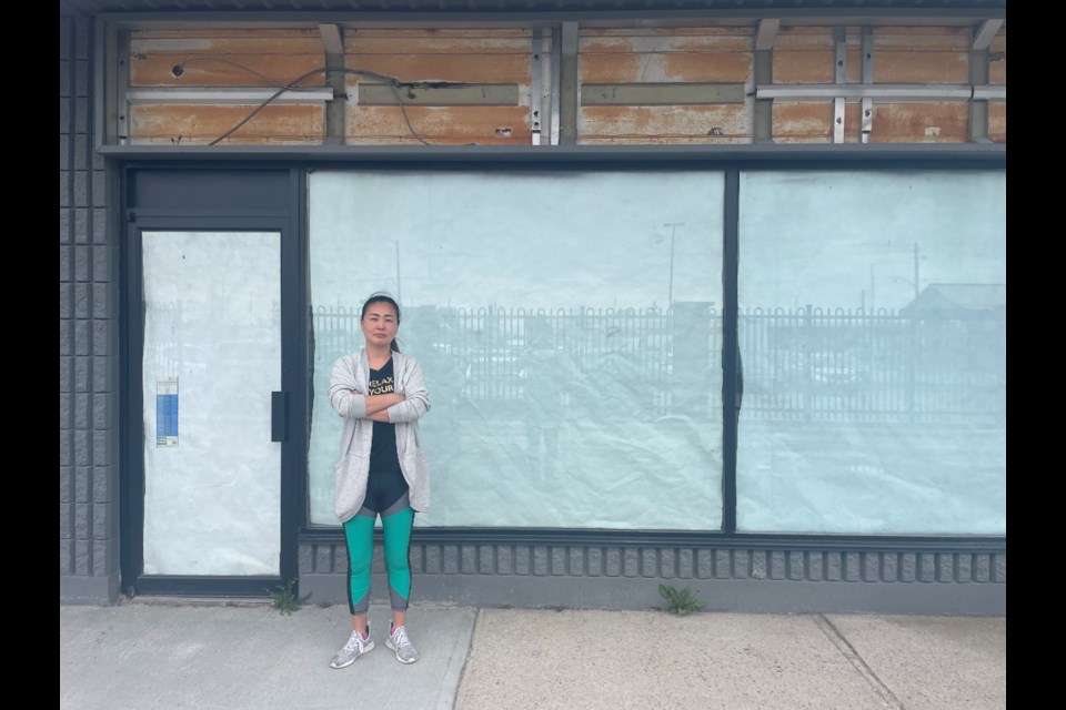 Business owner YJ Hong-McParland ended her lease at the 10 Western Ave. shopping plaza after construction delays continued for four months after the property owner said they would be complete.