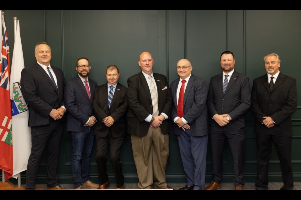 Standing from left to right are Renfrew town councillors John McDonald, Andrew Dick, Jason Legris, Mayor Tom Sidney, Reeve Peter Emon and councillors Kyle Cybulski and Clint McWhirter.