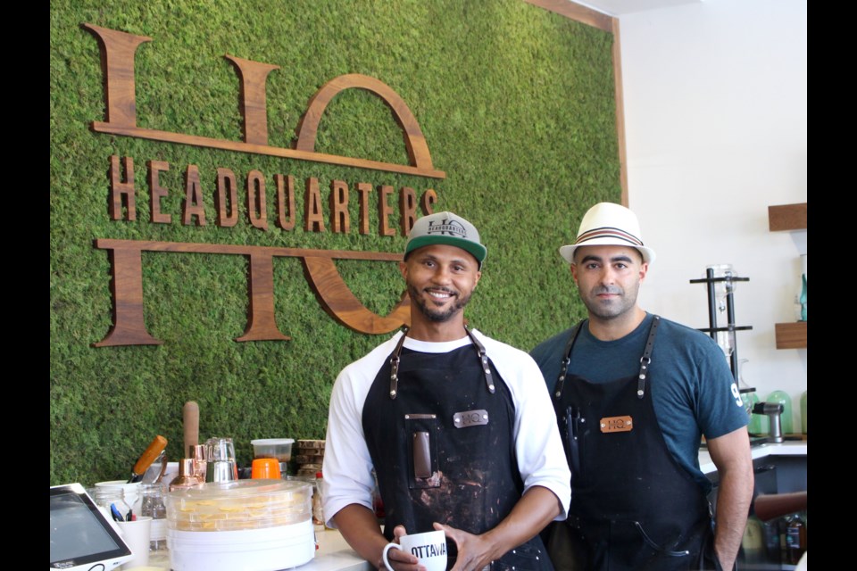 Damien Carvery (left) and Aydin Kharaghani (right) started HeadQuarters in late 2017. Kharaghani said the green wall behind the bar is made of moss. Drew May/ OttawaMatters.com