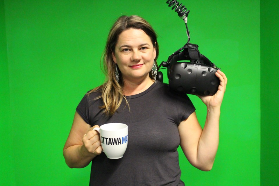Rebecca Johnston, co-owner of Colony VR, is providing a space for people in Ottawa to play with and experiment with virtual reality technology. The business is also working on developing its own virtual reality products, she said. Drew May/ OttawaMatters.com