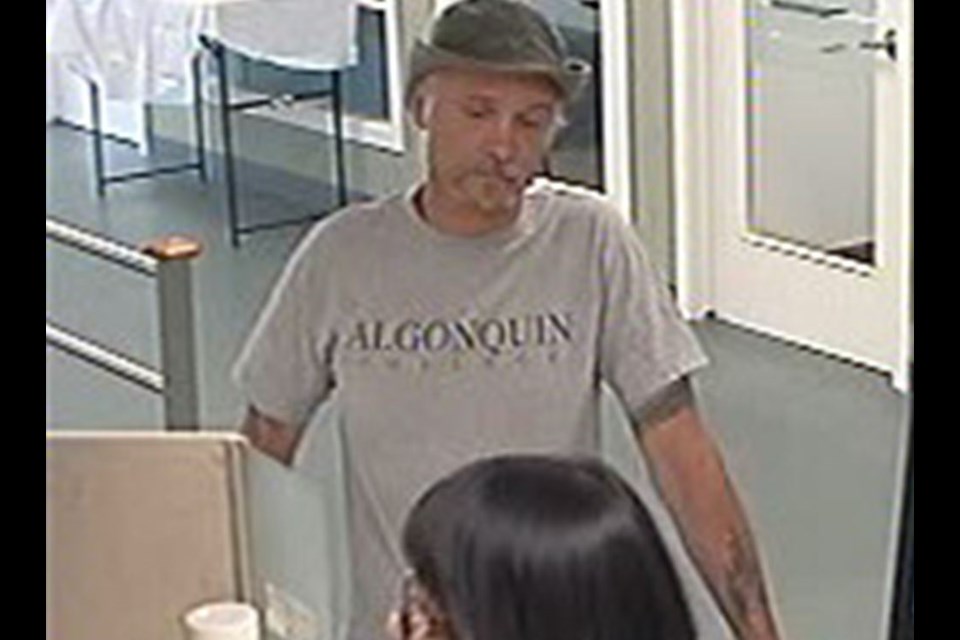 A man wanted in two bank robberies along Carling Avenue, July 21, 2018. Photo/ Ottawa Police Service