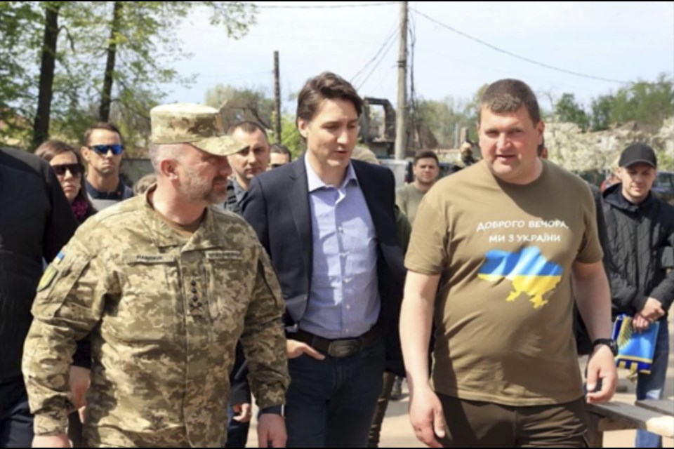 This image provided by the Irpin Mayor's Office shows Canadian Prime Minister Justin Trudeau walking with mayor Oleksandr Markushyn, right, in Irpin, Ukraine, Sunday, May 8, 2022. Trudeau made a surprise visit to Irpin on Sunday. The city was severely damaged during Russiaâ€™s attempt to take Kyiv at the start of the war. 