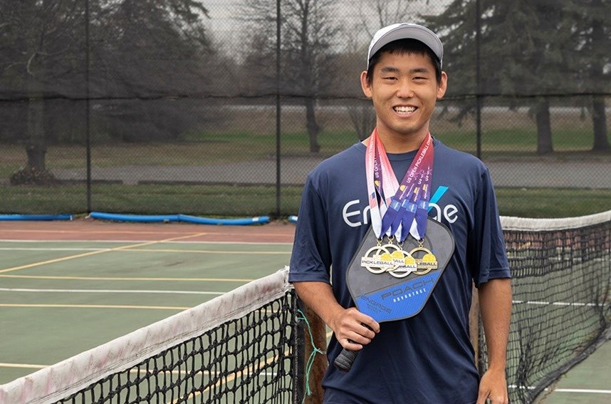 Matthew Kawamoto shows off the medals he won during the U.S. Open Pickleball Championship in Naples, Florida from April 21 to April 29. Photo/ Devyn Barrie