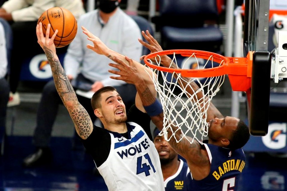 Then-Minnesota Timberwolves forward Juancho Hernangomez (41) shoots against then-Denver Nuggets guard Will Barton in the second quarter during an NBA basketball game, in Minneapolis, Sunday, Jan. 3, 2021. The Toronto Raptors signed guard Barton and, in turn, forward Juancho Hernangomez on Tuesday. THE CANADIAN PRESS/AP-Andy Clayton-King