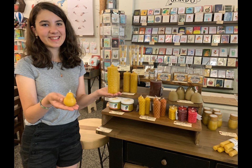 Anna Chandler Merlo, 12, holding her personal favourite handmade products on display at Maker House Co. on Wellington Street West. (Andrew PInsent/OttawaMatters.com)