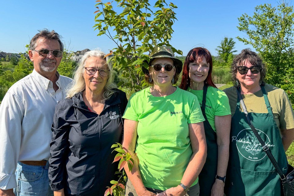 Town staff, elected officials, and Pelham Garden Club members gather at the official ribbon cutting for the planting of ten Cherry birch trees on June 24 2024.