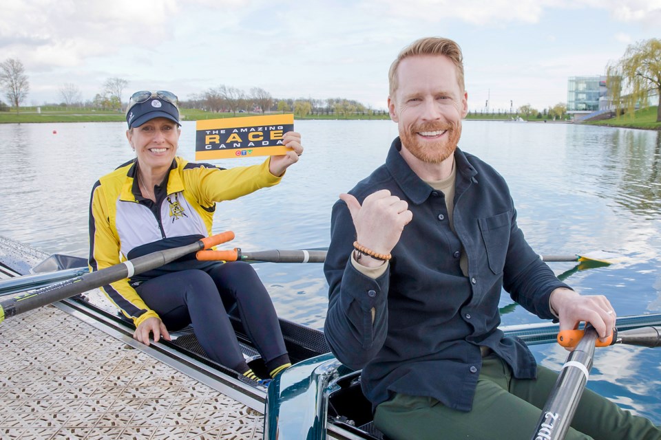 SNRC rower Rhonda Chopin and Amazing Race Canada host Jon Montgomery in a rowing shell at the dock of the Welland course.