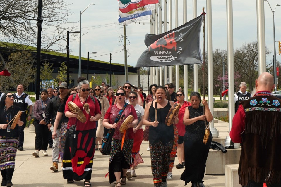 Attendees participated in a symbolic walk of solidarity and peace, led by Indigenous women singers and drummers