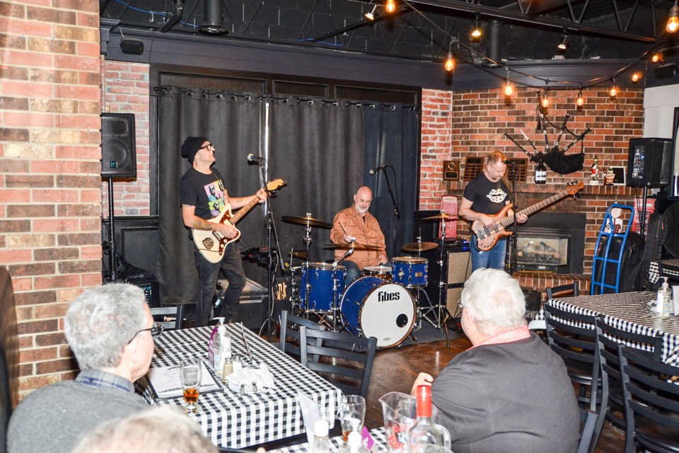 Drummer Jim Casson and guitarists Michael Wainwright and Rich Moore play to an enthusiastic audience at Peter Piper’s Pubhouse on Sunday afternoon, Feb. 26 2023.