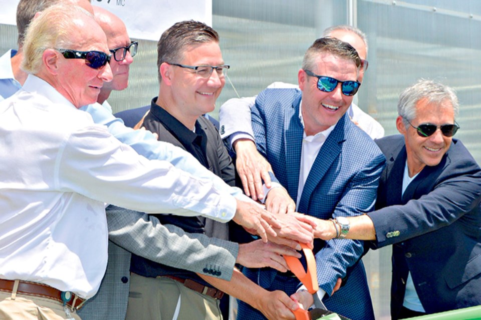 In June 2018, former Pelham Mayor David Augustyn, centre, with CannTrust officials at the Fenwick facility's official opening. Far left, Eric Paul; in mirrored sunglasses, Peter Aceto; far right, Mark Litwin. Augustyn declared that the company's marijuana operation “provides hope to our community.” Paul, Aceto, and Litwin later faced criminal charges related to illegal cannabis growing at the site. They were acquitted in December 2022. VOICE FILE