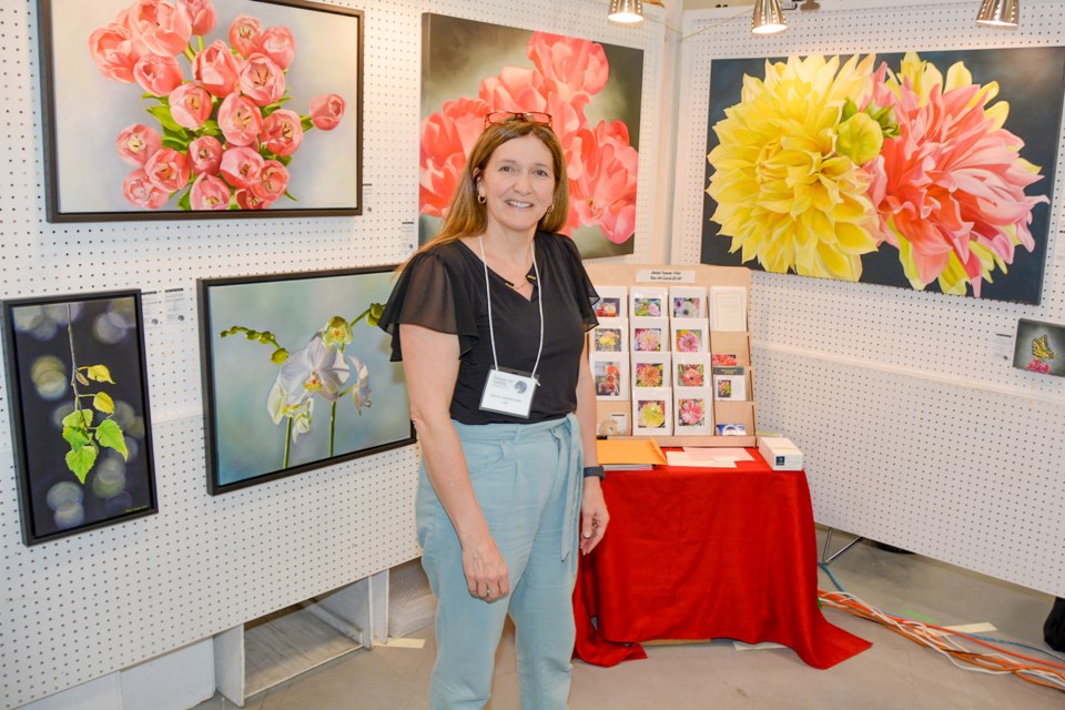 Sheila Vander Wier, from Fenwick, a five-year veteran of the festival, has a penchant for painting flowers in oil.