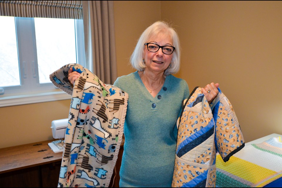 Debbie Mailhot, with her blanket creations for Project Linus.