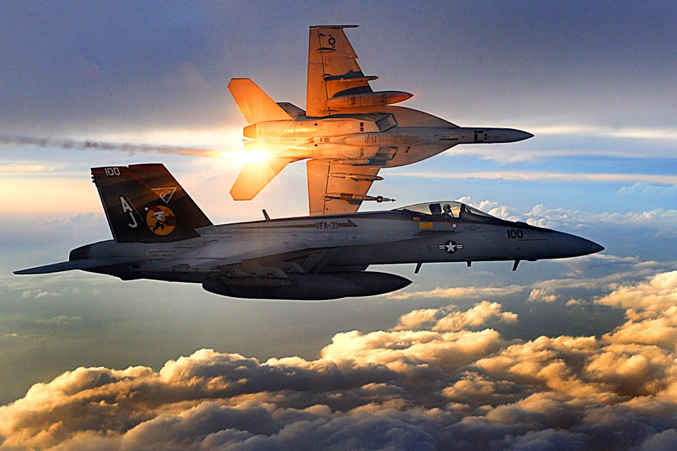 Two U.S. Navy F/A-18 Super Hornets from Strike Fighter Squadron 31 fly a combat patrol over Afghanistan on Dec. 15, 2008.