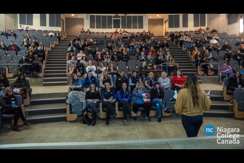 Prospective students and their parents attend a presentation in one of Niagara College’s lecture halls.