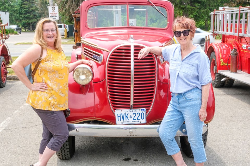 Lisa Humphries and Janet Begin check out a classic pumper.
