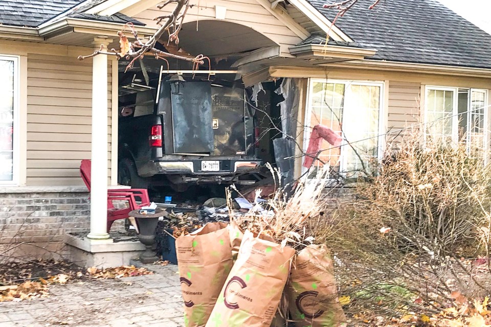 Truck embedded in front entryway.