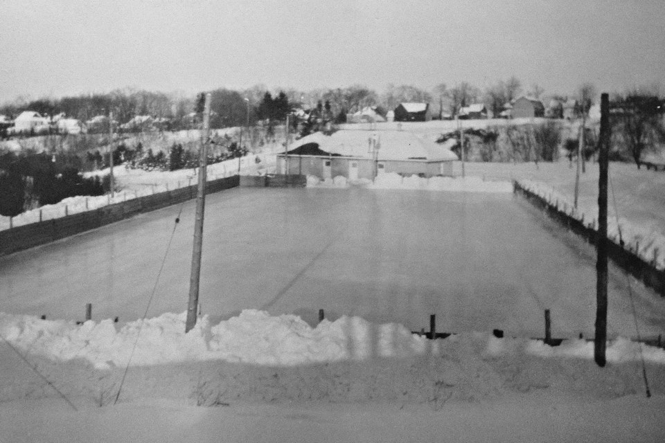 The ice pad at "The Pit," in Fonthill, later renamed Marlene Stewart Streit Park, facing west, with Highway 20 running along the ridge. Date unknown, but likely 1950s.