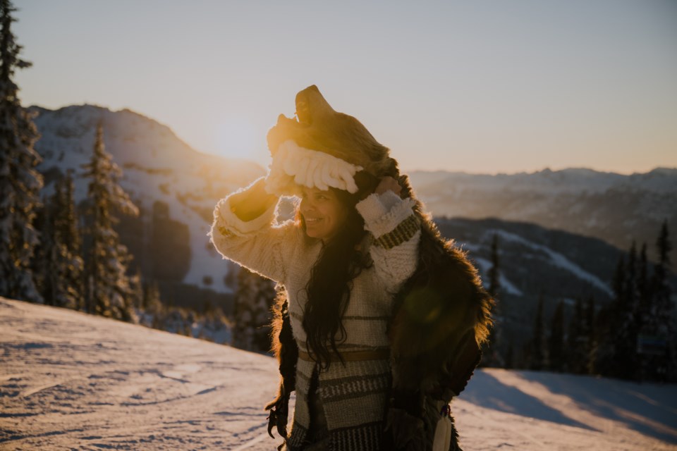 Jackie Andrew in the traditional grizzly bear hide.