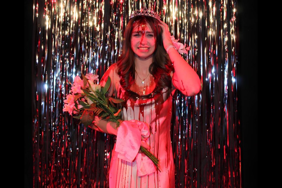 Whistler Secondary School 12th-grader Kiara Felice portrays Carrie White in her school's 2025 rendition of "Carrie: The Musical."