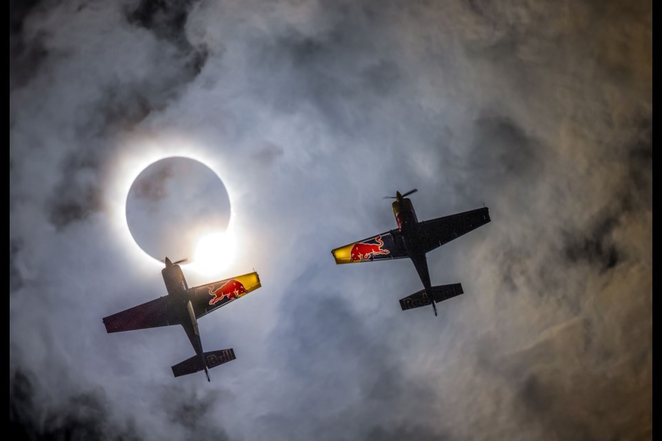 Red Bull pilots Pete McLeod and Kevin Coleman fly through the total solar eclipse on April 8, 2024 in Sulphur Springs, Texas.