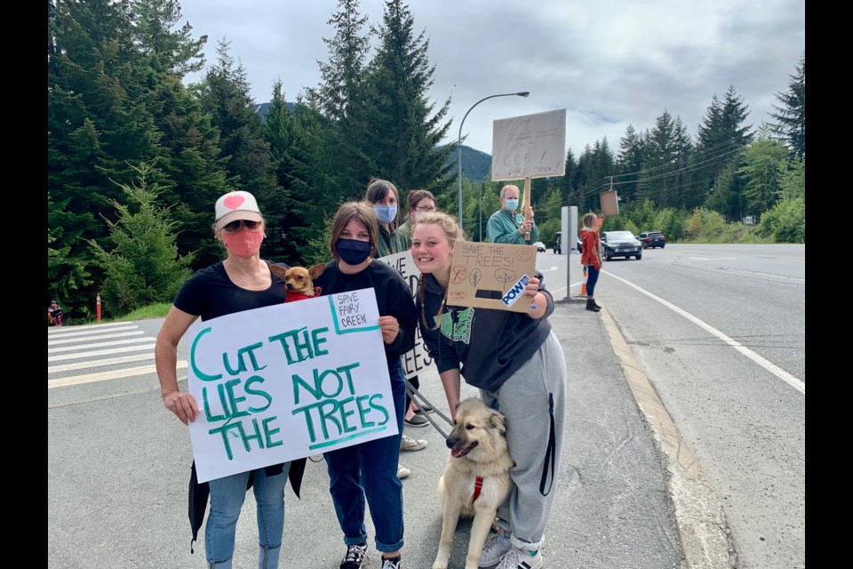 From left to right, Whistler locals Sandra Haziza, Sierra Haziza and Mallory Mellor speak out against old-growth logging in B.C. at a demonstration on Sunday, May 30. 