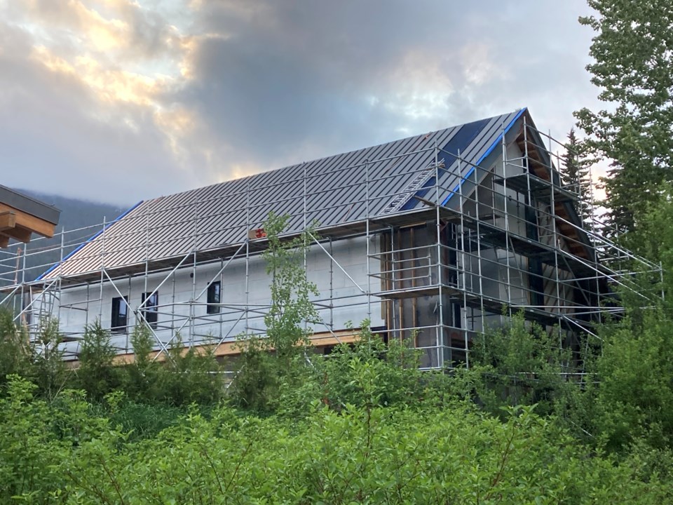 house-under-construction-in-whistler-with-clouds-in-background-from-different-angle-taken-by-robert-wisla