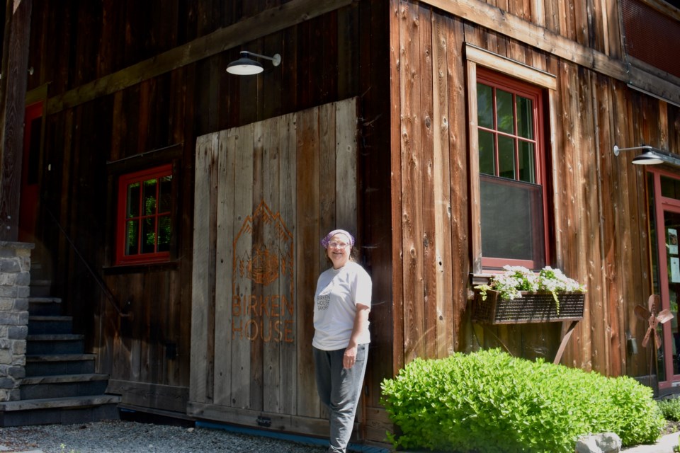 Owner Eileen Keenan stands in front of the house she—literally and metaphorically—built.
