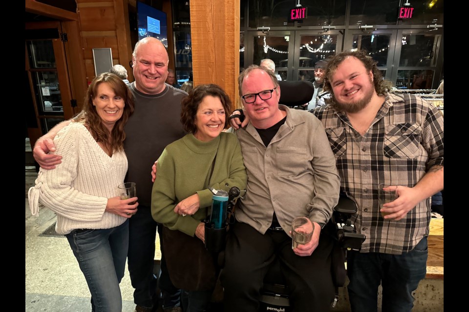Pemberton resident and longtime Whistler Blackcomb employee Wayne Wiltse, second from right, smiles alongside his son Logan (right), wife Annette (centre) and friends during a fundraiser at Dusty’s on Jan. 31. 