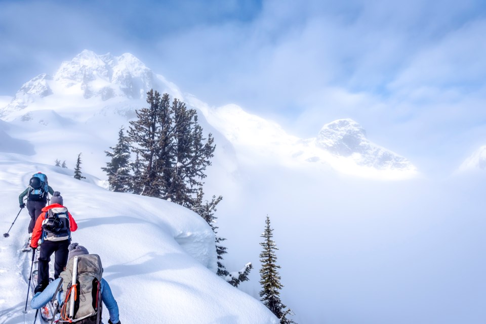 Backcountry skiing uphill in Whistler BC