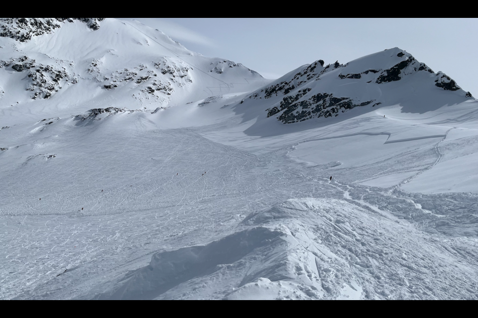 Patrollers can be seen here responding to a Size 2 avalanche that released on Blackcomb Glacier on Wednesday, April 6. The slide was reportedly triggered by a bootpacker following a track, visible to the right of the photo.