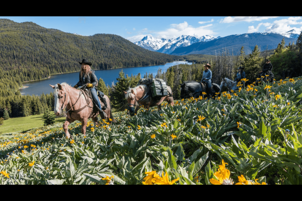 Pack horses is one way to travel around the picturesque Spruce Lake, located in B.C.'s South Chilcotin Mountains Park. Photo courtesy of Chilcotin Holidays