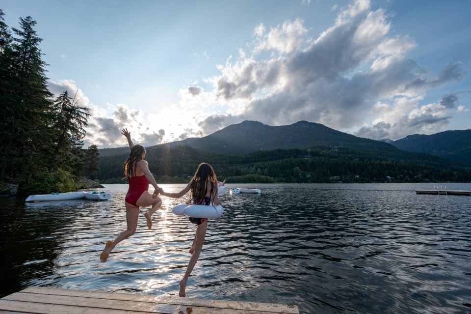 kids jumping off whistler bc dock into alta Lake