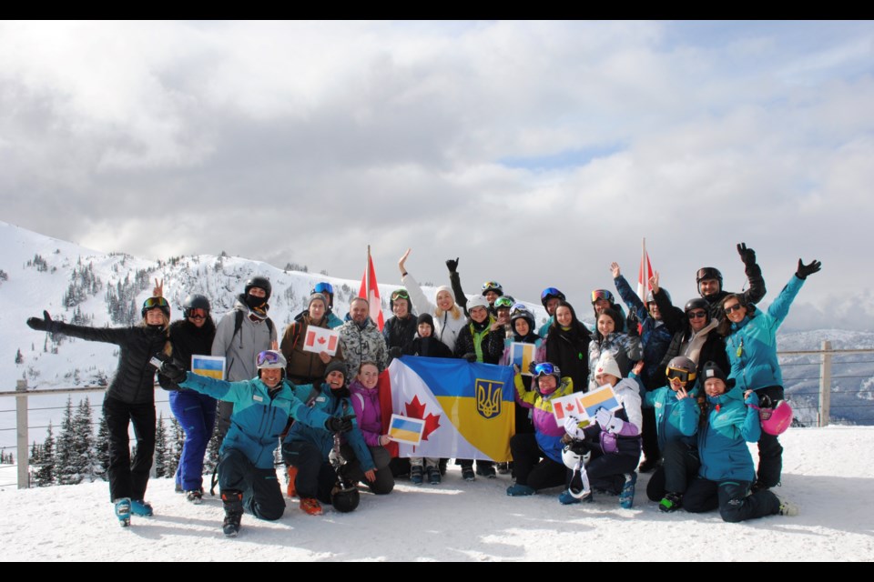 A group of 23 Ukrainians snap a photo outside Whistler’s Roundhouse during a “initiation ski day” on Monday, March 6.