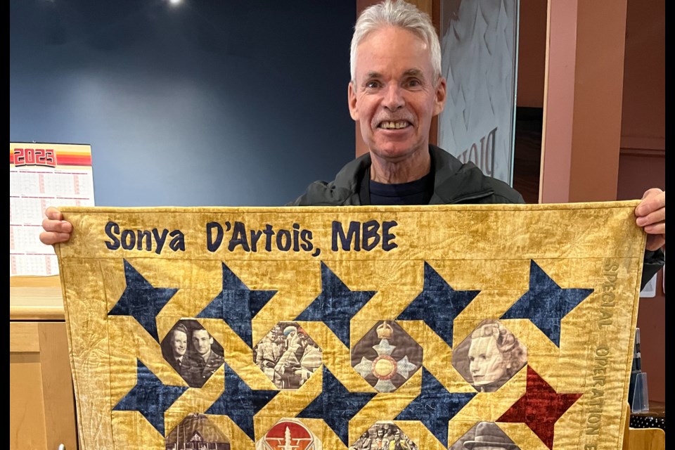  A heritage quilt made in honour of Canadian war hero and spy, Sonya d’Artois, in the hands of her son, Whistler realtor Michael d’Artois.