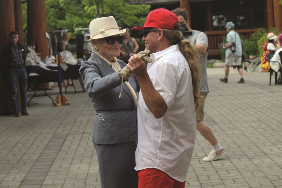 On Thursday, June 17, Arts Whistler hosted the Fashion Garden Party at Our Lady of the Mountains Church in honour of indelible Whistler artist and bon vivant Isobel MacLaurin’s 90th birthday, and to raise money for the Alzheimer Society of B.C. To cap the festivities, Paul Fournier led (or was it the other way around?) Isobel in a dance to “Lady in Red.”