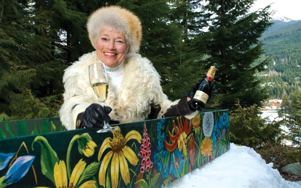 The inimitable Whistler artist Isobel MacLaurin shows her zest for life as she enjoys champagne while sitting in her hand-painted coffin.