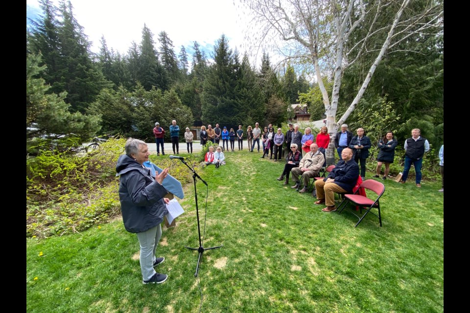Ewa Zebrowski speaks to the assembled crowd at Eva Lake Park for the unveiling of a new interpretive panel in honour of her father, Walter. 