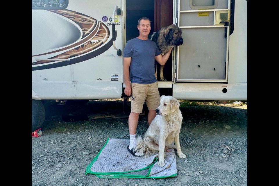Paul Stephens lives in an RV on a forest service road near Whistler with his two dogs. He wants a safe, permanent site established for people like him. 