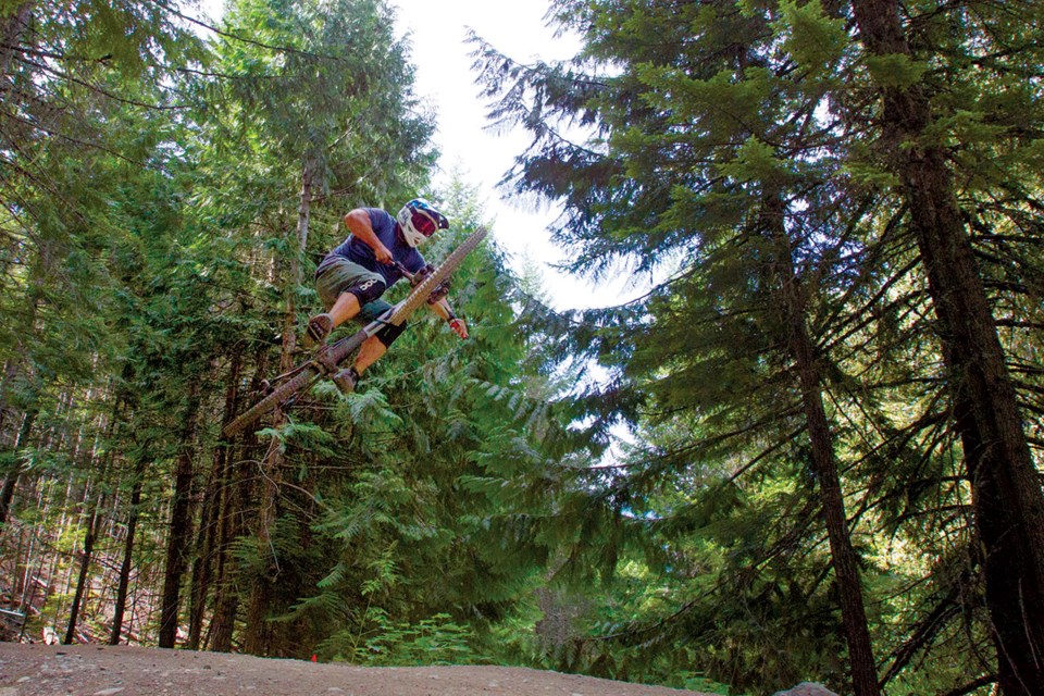 DOWNHILL DEEDS Photographer and Pique columnist Vince Shuley spent the day in the Whistler Mountain Bike Park last week and snapped some shots as his crew enjoyed the runs.
Photo by Vince Shuley.