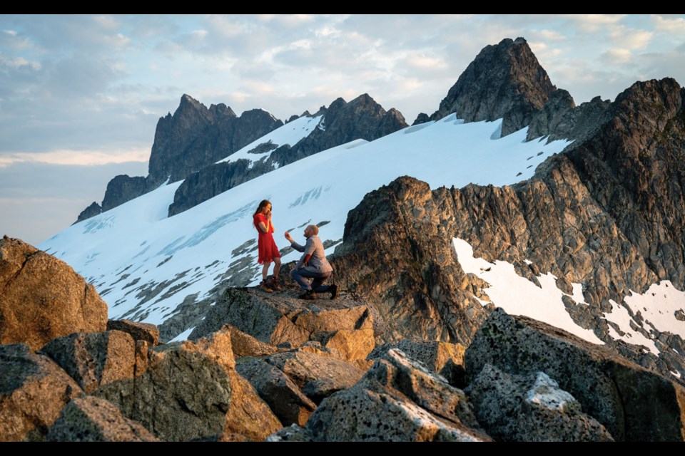 I DO Whistler photographer Mike Crane proposes to Whistler artist Jenna Jones in the Tantalus Range. And yes, Jenna said yes!
Photo submitted by Mike Crane / @mikecranephotography