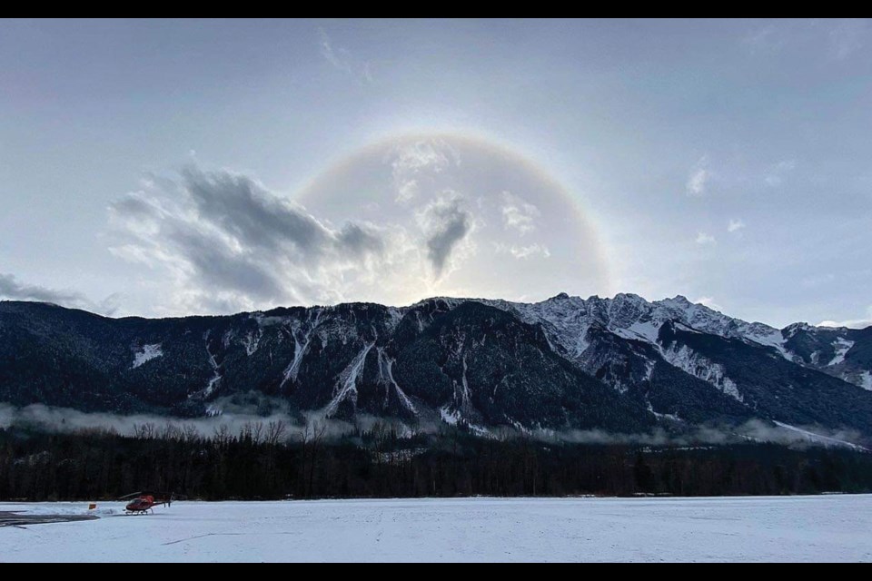 SUNRISE SUNDOG A morning sundog rises over Mount Currie, as seen from Blackcomb Helicopters’ base. 
Photo by Taylor Lovering