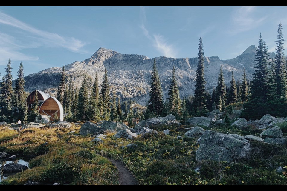 HIKES TO HUTS The Wendy Thompson Hut glowing during golden hour. 