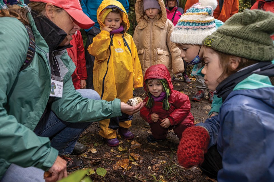 FUNGUS AMONG US Get them started young! These tiny hikers braved the rain to learn about mushrooms during the 19th annual Fungus Among Us festival.