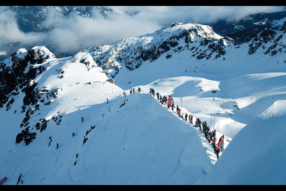 DROPPING IN Competitors line up on Blackcomb Mountain to compete in the International Freeskiers & Snowboarders Association’s Freeride World Qualifier event on Wednesday, March 23.