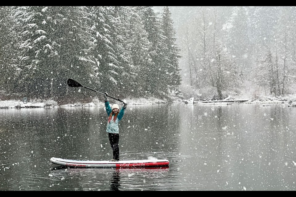 STORM BOARDING Seanna Lawson hopped on her paddleboard for a snowy trip around the lake on Sunday, April 3.